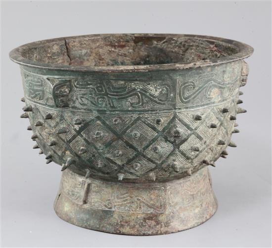 A Chinese archaic bronze ritual food vessel, Yu, Shang dynasty, Anyang type, 17cm high, 25.5cm diameter, crack